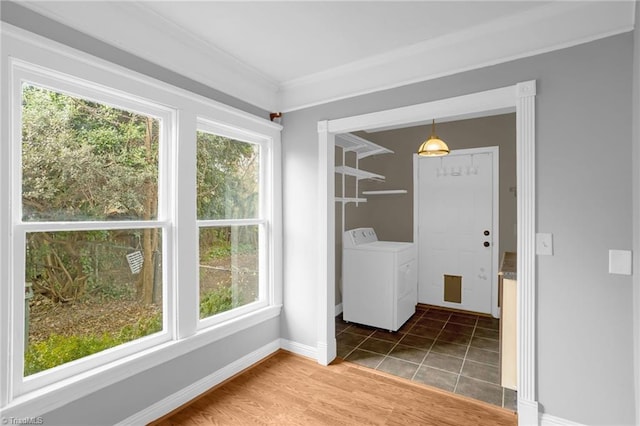 clothes washing area with hardwood / wood-style flooring and ornamental molding