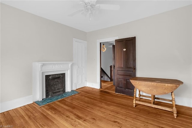 unfurnished room with wood-type flooring and ceiling fan