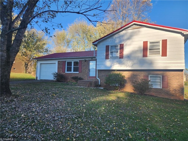 split level home featuring a front lawn and a garage