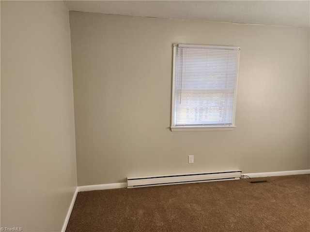 spare room with a baseboard radiator and carpet floors