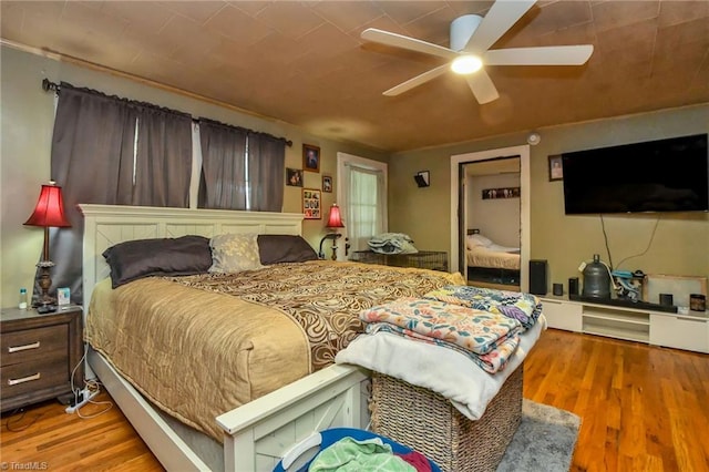 bedroom featuring hardwood / wood-style flooring and ceiling fan