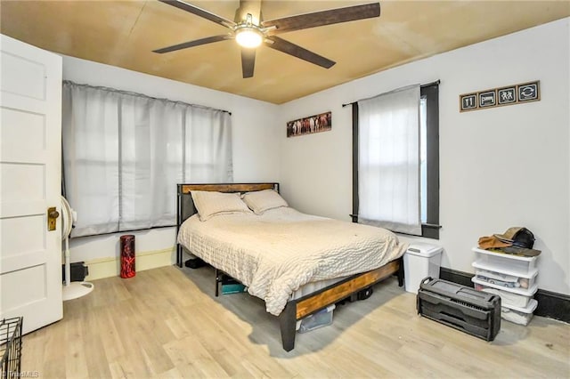 bedroom featuring light hardwood / wood-style floors and ceiling fan