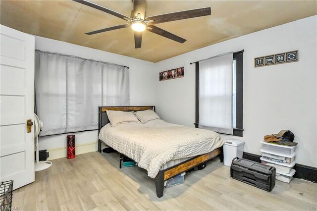 bedroom featuring ceiling fan and light hardwood / wood-style floors