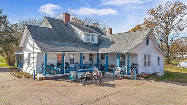 back of house with a porch