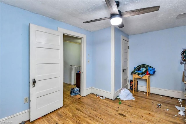 bedroom with ceiling fan and wood-type flooring