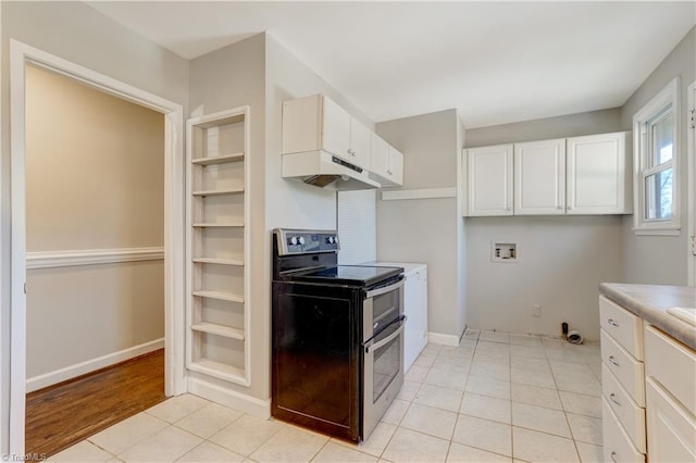 kitchen featuring white cabinets, range with two ovens, and light tile patterned floors