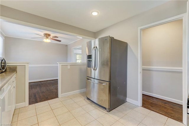 kitchen with light tile patterned flooring, appliances with stainless steel finishes, and plenty of natural light