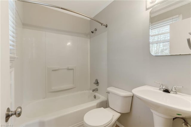 full bathroom with sink, shower / tub combination, and toilet