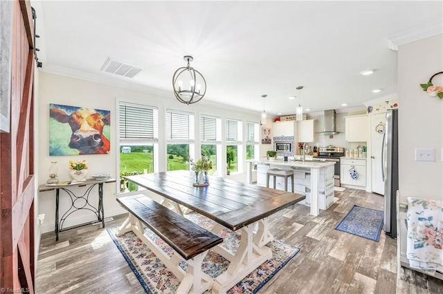 214 Mining Ridge Church Rd, Elkin, NC 28621 - dining area featuring ornamental molding, a chandelier, light wood-type flooring, and recessed lighting