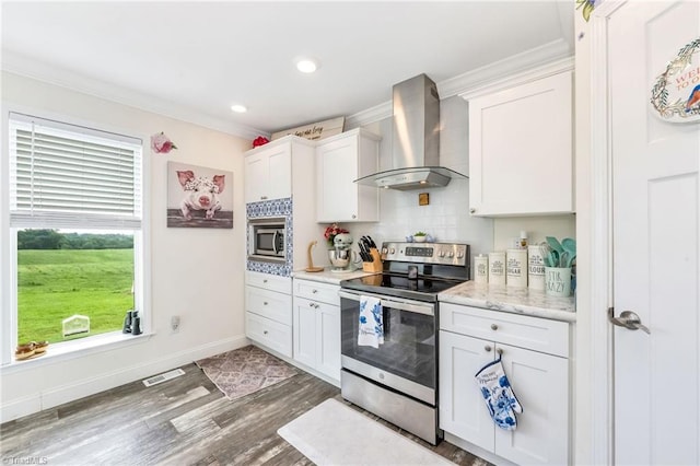 214 Mining Ridge Church Rd, Elkin, NC 28621 - kitchen with wall chimney exhaust hood, stainless steel appliances, crown molding, white cabinetry, and tasteful backsplash