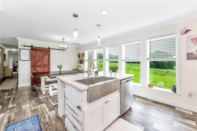 214 Mining Ridge Church Rd, Elkin, NC 28621 - kitchen featuring stainless steel dishwasher, ornamental molding, a barn door, healthy amount of natural light, and wood finished floors