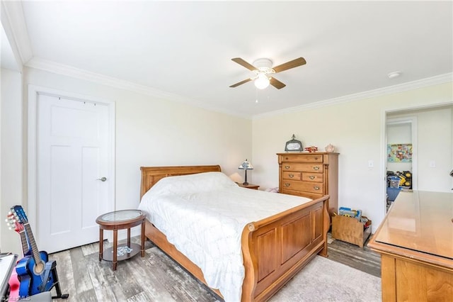 214 Mining Ridge Church Rd, Elkin, NC 28621 - bedroom with light wood-style flooring, ornamental molding, and a ceiling fan