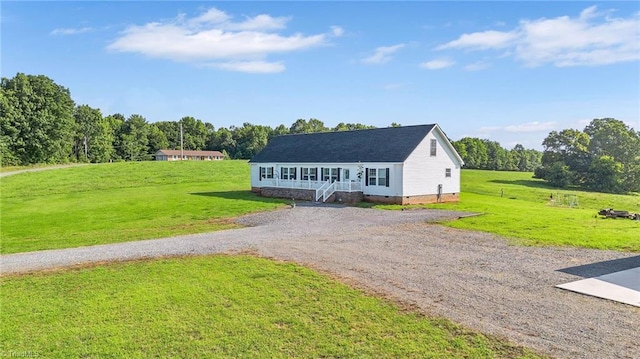 214 Mining Ridge Church Rd, Elkin, NC 28621 - view of front of house with crawl space, a front yard, gravel driveway, and covered porch