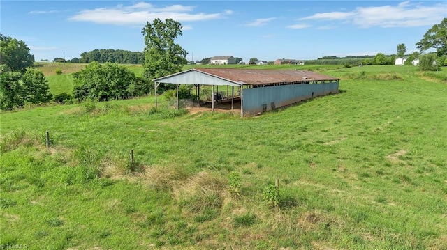 214 Mining Ridge Church Rd, Elkin, NC 28621 - view of grassy yard with a pole building, a carport, a view of countryside, and an outbuilding