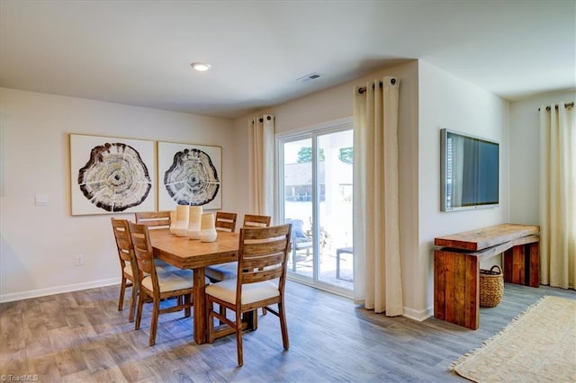 dining space featuring hardwood / wood-style floors