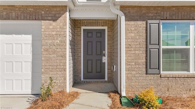 entrance to property featuring a garage