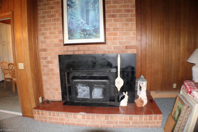 room details featuring carpet and wood walls