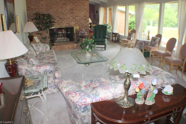 living room with a brick fireplace