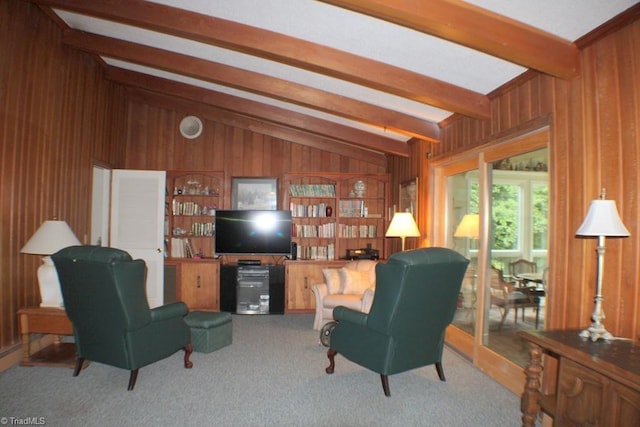 carpeted living room with vaulted ceiling with beams and wooden walls