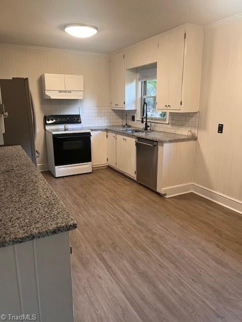 kitchen featuring dishwasher, dark hardwood / wood-style floors, black fridge, white electric range oven, and white cabinets