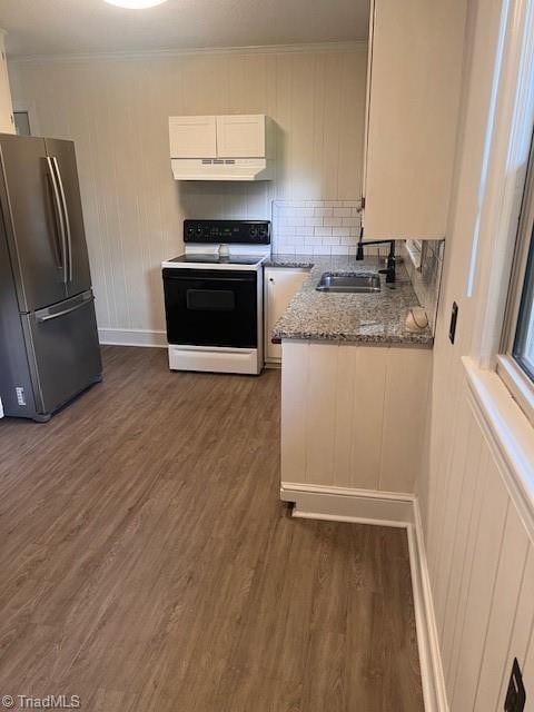 kitchen with sink, white range with electric cooktop, stainless steel fridge, white cabinets, and dark wood-type flooring