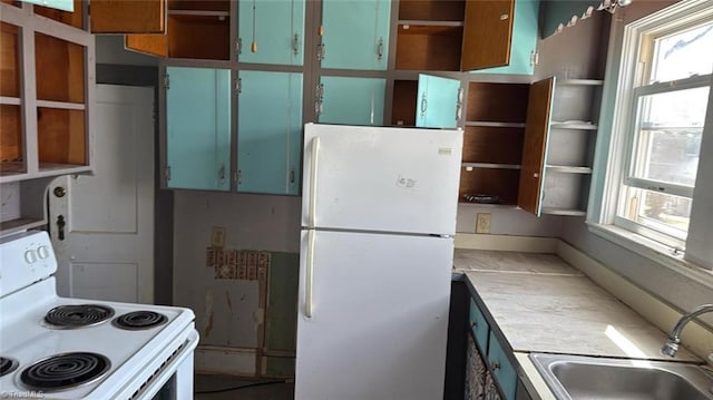 516 Hamilton St, Eden, NC 27288 - kitchen with white appliances, open shelves, a sink, and healthy amount of natural light