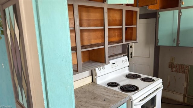 516 Hamilton St, Eden, NC 27288 - kitchen featuring white electric range oven and light countertops