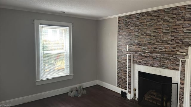 516 Hamilton St, Eden, NC 27288 - unfurnished living room featuring dark wood finished floors, ornamental molding, baseboards, a fireplace, and a textured ceiling