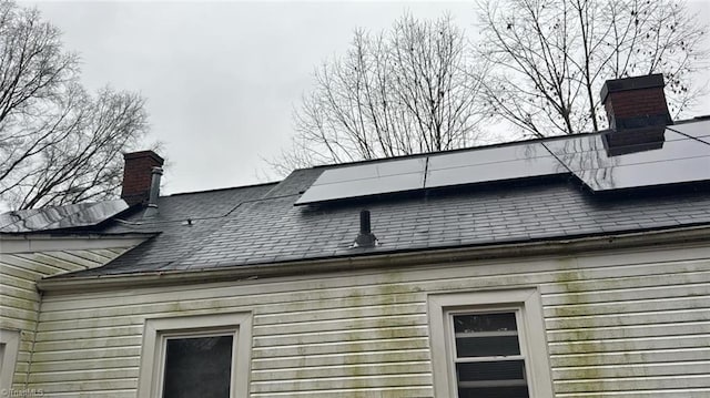 516 Hamilton St, Eden, NC 27288 - exterior view of a chimney and roof with shingles