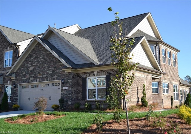 craftsman-style house with concrete driveway, roof with shingles, and a garage