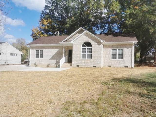 ranch-style house with a front lawn