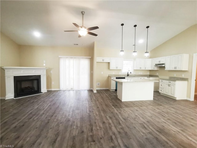 kitchen with dark hardwood / wood-style flooring, white cabinetry, vaulted ceiling, pendant lighting, and a center island