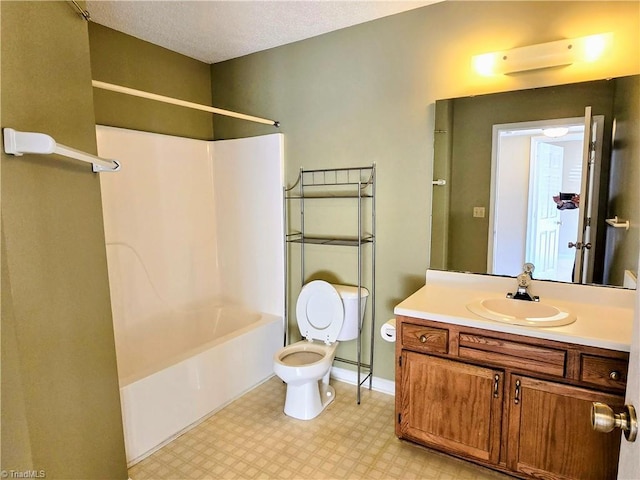 full bathroom with vanity, toilet, and washtub / shower combination