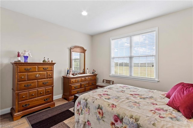 bedroom with light hardwood / wood-style flooring