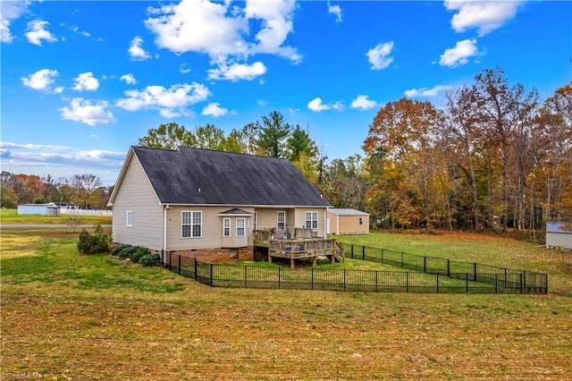 back of house with a yard and a deck