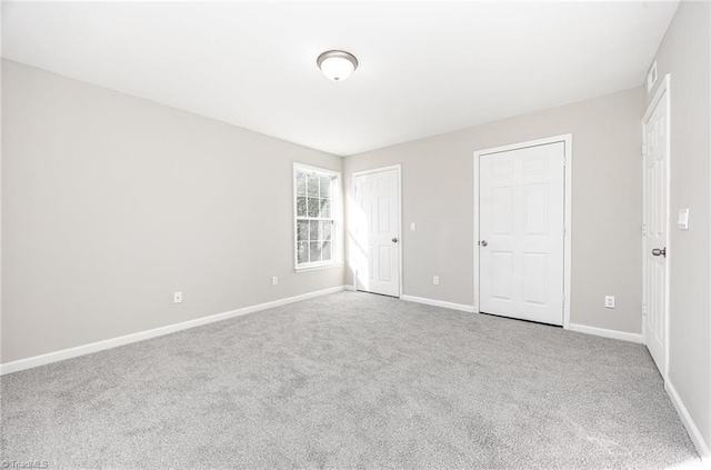 unfurnished bedroom with carpet flooring