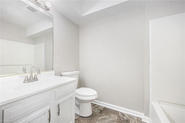 bathroom featuring vanity and toilet