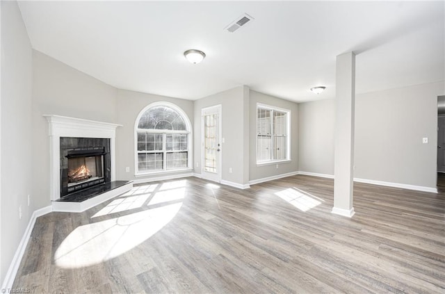 unfurnished living room with hardwood / wood-style flooring