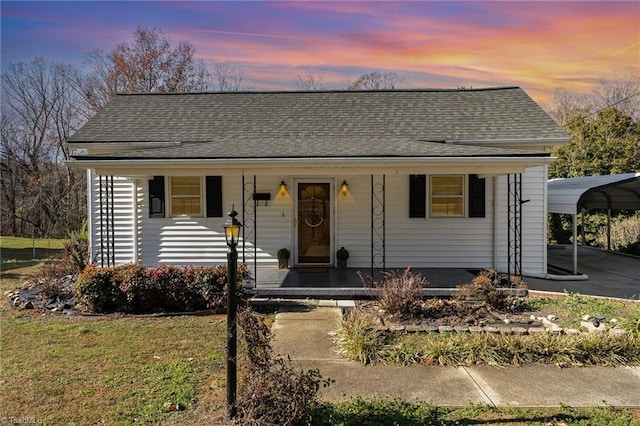 view of front facade featuring a carport and covered porch