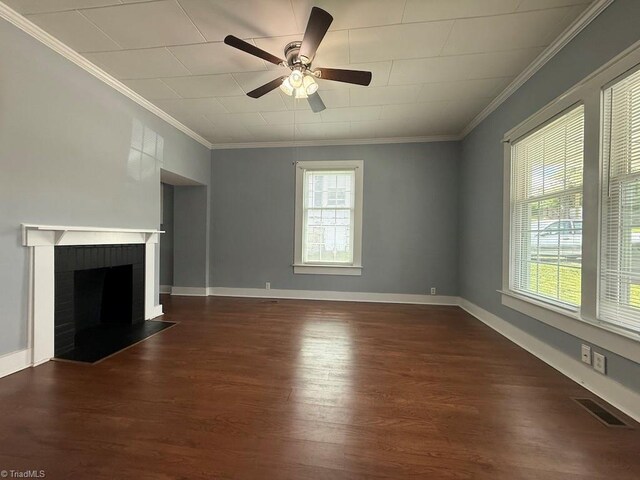 446 Durham St, Mount Airy, NC 27030 - unfurnished living room with dark wood-type flooring, crown molding, ceiling fan, a fireplace, and baseboards