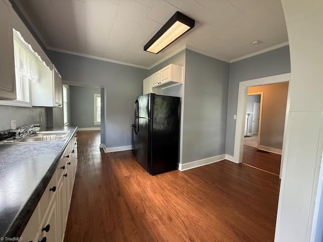 446 Durham St, Mount Airy, NC 27030 - kitchen with freestanding refrigerator, a sink, white cabinets, dark wood finished floors, and baseboards