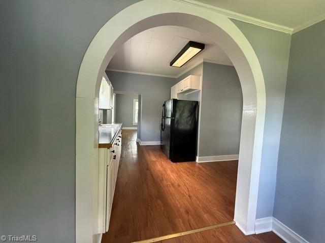 446 Durham St, Mount Airy, NC 27030 - hall featuring dark wood-style floors, crown molding, baseboards, and arched walkways