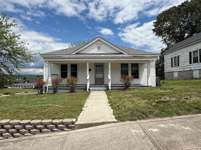 446 Durham St, Mount Airy, NC 27030 - bungalow-style house featuring a porch, a front lawn, and roof with shingles