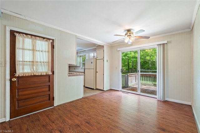 1553 Carson Rd, Pilot Mountain, NC 27041 - spare room featuring ornamental molding, ceiling fan, wood finished floors, and baseboards