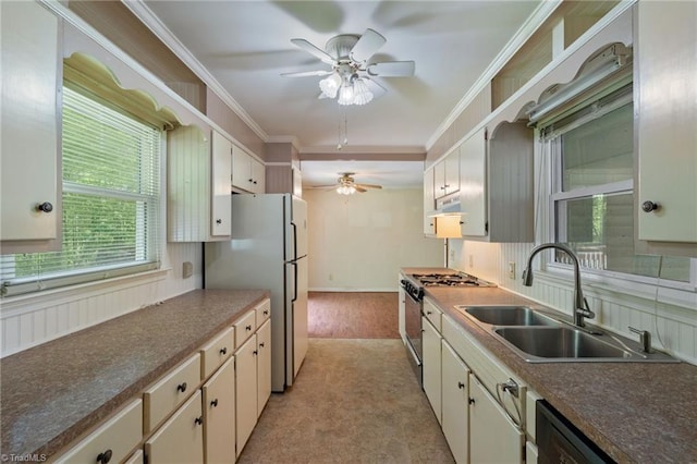1553 Carson Rd, Pilot Mountain, NC 27041 - kitchen with gas stove, a sink, a ceiling fan, dishwasher, and crown molding