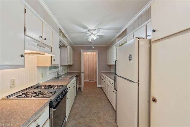 1553 Carson Rd, Pilot Mountain, NC 27041 - kitchen featuring freestanding refrigerator, gas stove, a sink, a ceiling fan, and under cabinet range hood