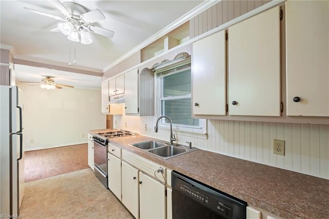 1553 Carson Rd, Pilot Mountain, NC 27041 - kitchen featuring gas range, dishwasher, a sink, freestanding refrigerator, and under cabinet range hood