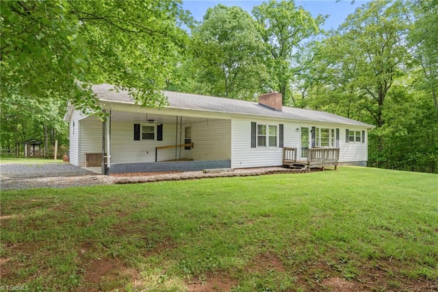 1553 Carson Rd, Pilot Mountain, NC 27041 - view of front of house with a chimney and a front lawn