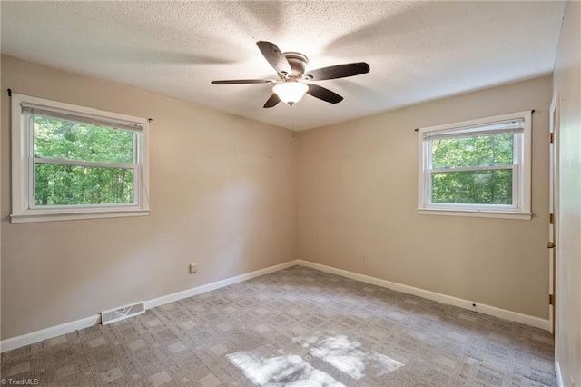 1553 Carson Rd, Pilot Mountain, NC 27041 - unfurnished room with a ceiling fan, baseboards, a textured ceiling, and carpet