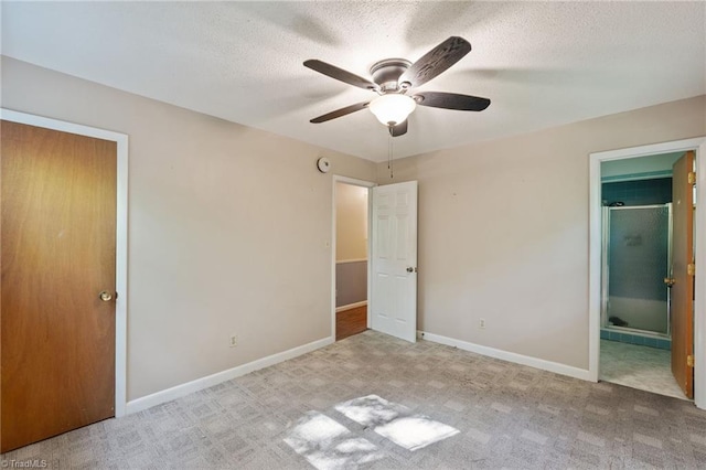 1553 Carson Rd, Pilot Mountain, NC 27041 - unfurnished bedroom featuring carpet, baseboards, a textured ceiling, and connected bathroom